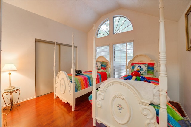 4406 Hidden Trace Ct, Houston, TX 77066 - bedroom featuring vaulted ceiling and wood finished floors