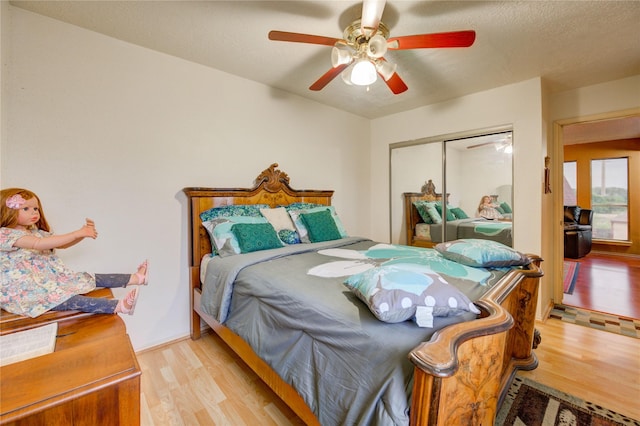 4406 Hidden Trace Ct, Houston, TX 77066 - bedroom with wood finished floors, a closet, and a ceiling fan