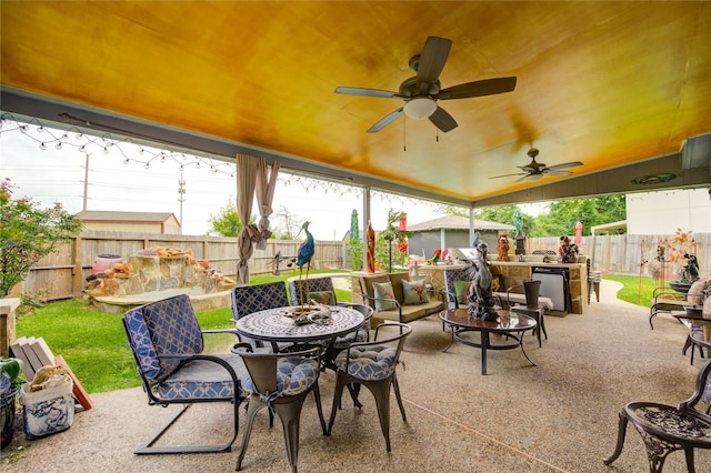 4406 Hidden Trace Ct, Houston, TX 77066 - fenced backyard with a patio, outdoor dining area, and a ceiling fan