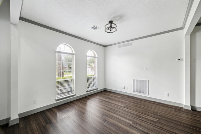 18715 Big Cypress Dr, Spring, TX 77388 - empty room featuring crown molding, dark wood-style flooring, a textured ceiling, and baseboards