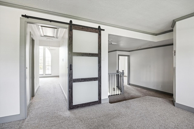 18715 Big Cypress Dr, Spring, TX 77388 - spare room featuring carpet, ornamental molding, baseboards, attic access, and a textured ceiling