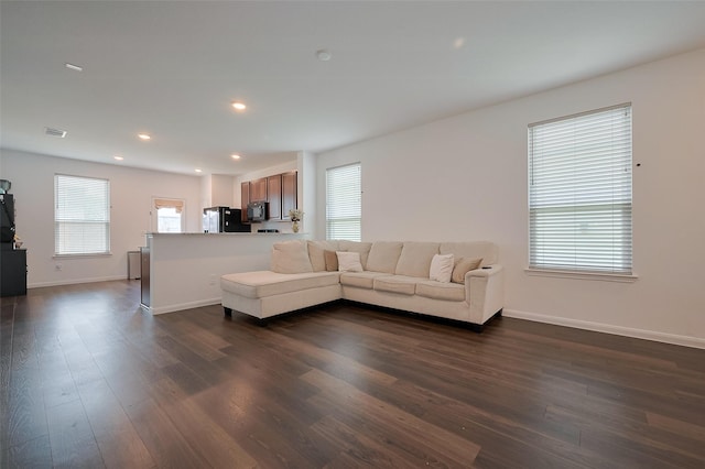 6718 Forbes Run Dr, Houston, TX 77075 - living room featuring dark wood finished floors, baseboards, and recessed lighting