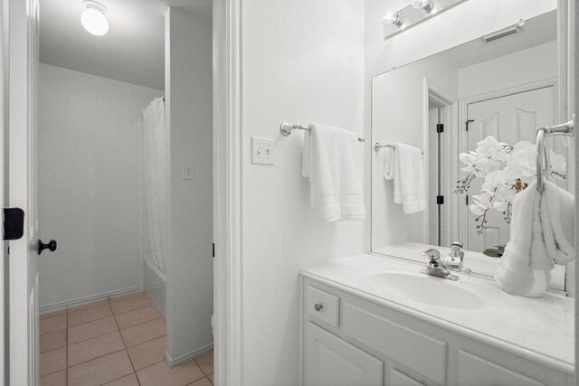 35 Dewdrift Pl, The Woodlands, TX 77382 - bathroom featuring vanity, tile patterned floors, and shower / tub combo