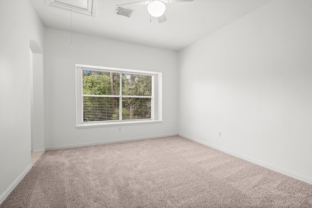 35 Dewdrift Pl, The Woodlands, TX 77382 - empty room featuring attic access, light colored carpet, a ceiling fan, and baseboards
