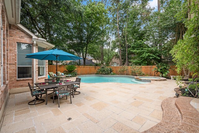 35 Dewdrift Pl, The Woodlands, TX 77382 - view of pool with a patio area, a fenced backyard, and a pool with connected hot tub
