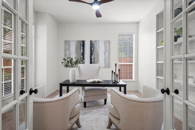 35 Dewdrift Pl, The Woodlands, TX 77382 - home office with light carpet, french doors, ceiling fan, and baseboards