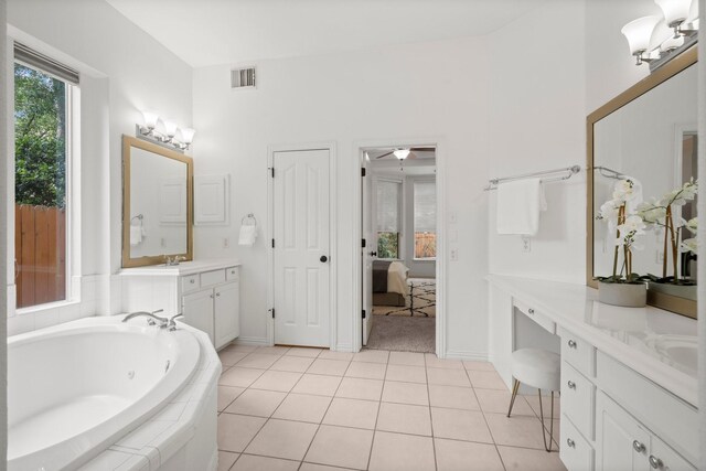 35 Dewdrift Pl, The Woodlands, TX 77382 - full bath featuring vanity, a whirlpool tub, ensuite bath, ceiling fan, and baseboards