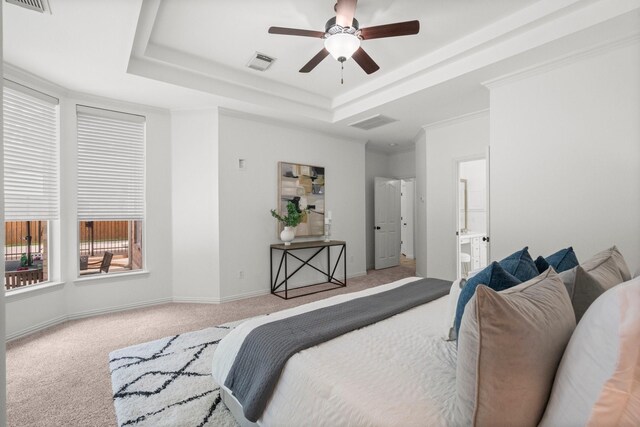 35 Dewdrift Pl, The Woodlands, TX 77382 - bedroom featuring carpet, a raised ceiling, ensuite bath, baseboards, and ceiling fan
