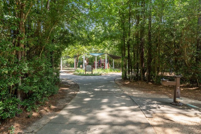 35 Dewdrift Pl, The Woodlands, TX 77382 - view of home's community featuring a detached carport and driveway