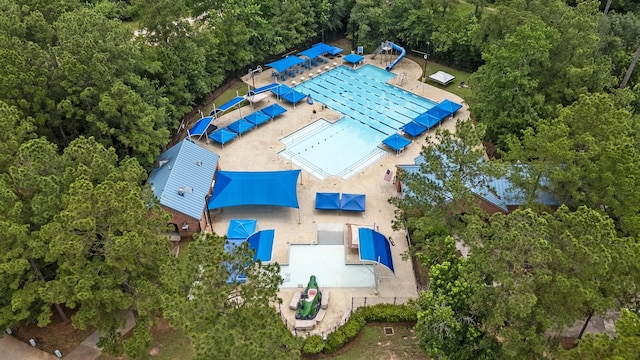 35 Dewdrift Pl, The Woodlands, TX 77382 - view of subject property featuring a pool area and a heavily wooded area
