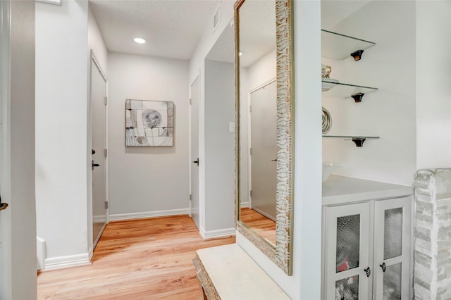 2014 Augusta Dr, Houston, TX 77057 - corridor featuring light wood-style floors and baseboards