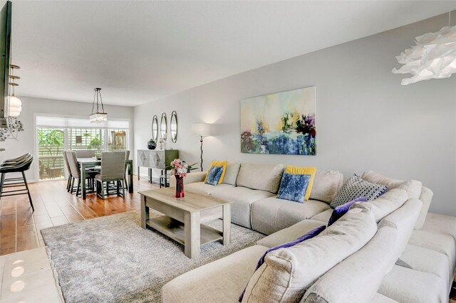 2014 Augusta Dr, Houston, TX 77057 - living room featuring wood finished floors and a chandelier