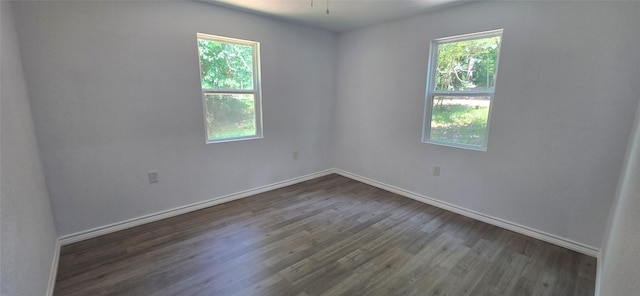 110 Hidden Cir, Coldspring, TX 77331 - spare room with plenty of natural light, dark wood-type flooring, and baseboards