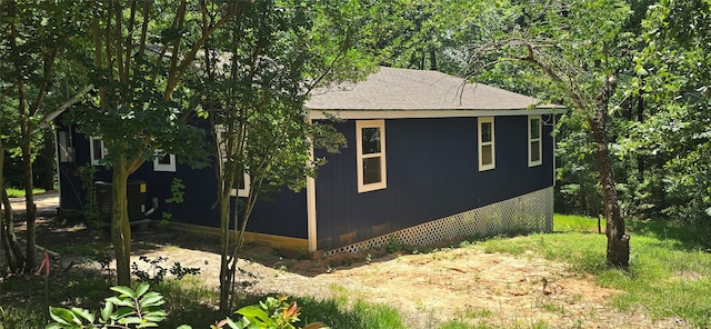 110 Hidden Cir, Coldspring, TX 77331 - view of property exterior featuring central AC unit and a shingled roof