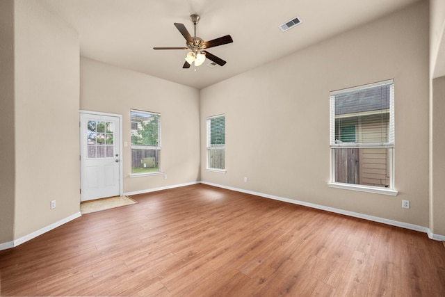25426 Saddlebrook Champion Way, Tomball, TX 77375 - spare room featuring wood finished floors, a ceiling fan, and baseboards