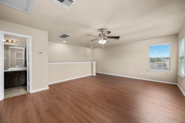 25426 Saddlebrook Champion Way, Tomball, TX 77375 - spare room with ceiling fan, wood finished floors, baseboards, recessed lighting, and a sink