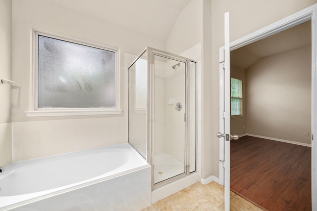 25426 Saddlebrook Champion Way, Tomball, TX 77375 - bathroom featuring a shower stall, vaulted ceiling, a garden tub, tile patterned flooring, and baseboards