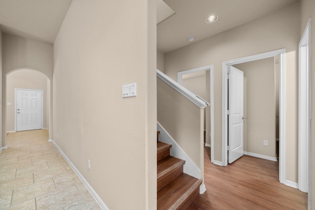 25426 Saddlebrook Champion Way, Tomball, TX 77375 - hall with arched walkways, baseboards, stairway, and recessed lighting