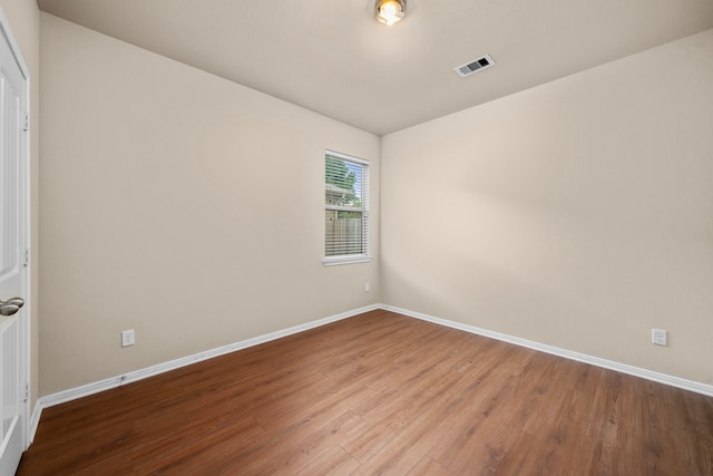 25426 Saddlebrook Champion Way, Tomball, TX 77375 - unfurnished room with wood finished floors and baseboards
