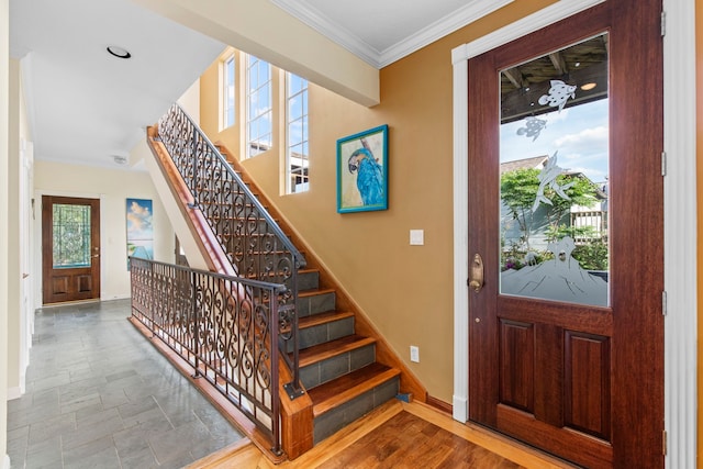 718 Pine Rd, Clear Lake Shores, TX 77565 - foyer entrance featuring baseboards, healthy amount of natural light, stairs, and ornamental molding