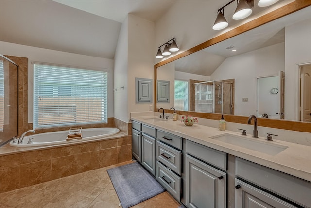 5918 Emmit Creek Ln, Sugar Land, TX 77479 - bathroom featuring lofted ceiling, healthy amount of natural light, tile patterned floors, a shower stall, and a bath