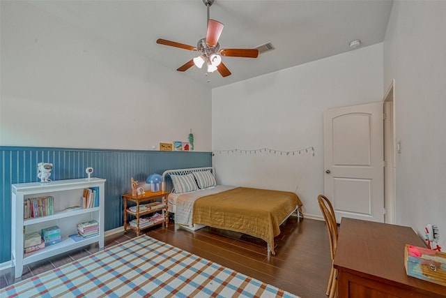 5918 Emmit Creek Ln, Sugar Land, TX 77479 - bedroom featuring wood finished floors, a ceiling fan, and a wainscoted wall