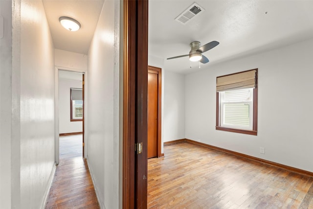 7009 Tuck St, Houston, TX 77020 - corridor featuring light wood-style flooring and baseboards