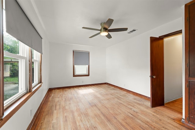 7009 Tuck St, Houston, TX 77020 - empty room featuring light wood-style floors, ceiling fan, and baseboards