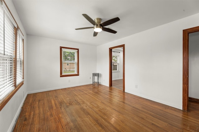 7009 Tuck St, Houston, TX 77020 - empty room with wood finished floors, a ceiling fan, and baseboards