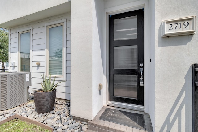 2719 Clay St, Houston, TX 77003 - property entrance featuring central air condition unit and stucco siding