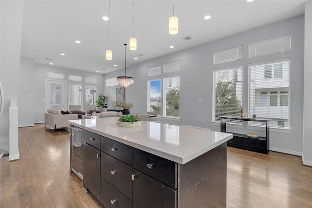 2719 Clay St, Houston, TX 77003 - kitchen featuring light wood-style flooring, light countertops, recessed lighting, and a kitchen island