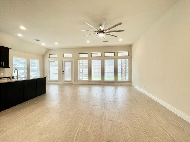 2023 Deer Vly, Missouri City, TX 77459 - unfurnished living room with ceiling fan, baseboards, recessed lighting, a sink, and light wood finished floors