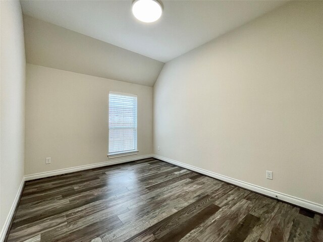 2023 Deer Vly, Missouri City, TX 77459 - spare room with dark wood finished floors, baseboards, and lofted ceiling