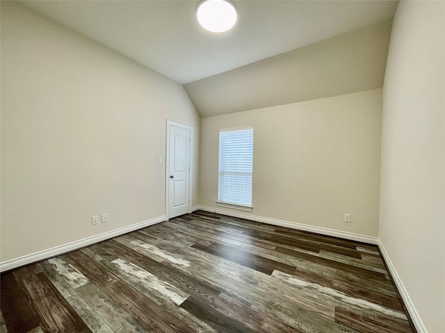 2023 Deer Vly, Missouri City, TX 77459 - empty room featuring dark wood-style flooring, baseboards, and lofted ceiling