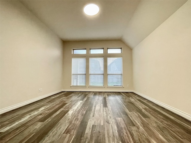 2023 Deer Vly, Missouri City, TX 77459 - additional living space featuring dark wood finished floors, baseboards, and lofted ceiling