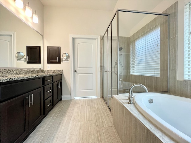 2023 Deer Vly, Missouri City, TX 77459 - full bathroom with vanity, a bath, and a stall shower