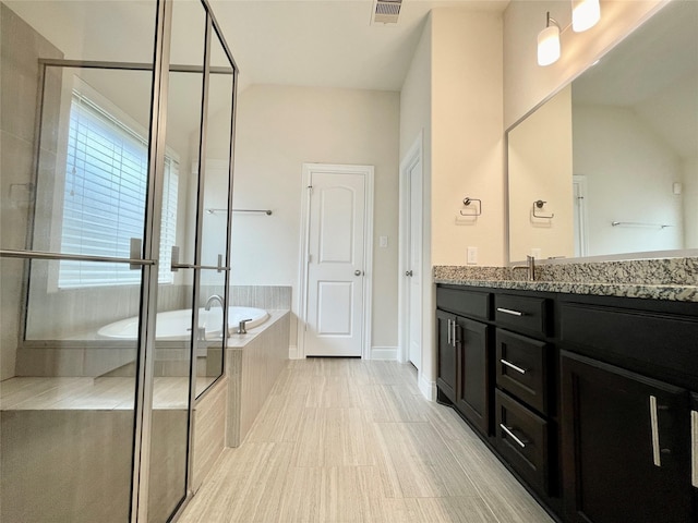 2023 Deer Vly, Missouri City, TX 77459 - full bath featuring vanity, a garden tub, and a stall shower