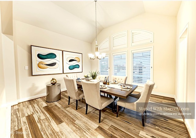 2023 Deer Vly, Missouri City, TX 77459 - dining room with a chandelier, vaulted ceiling, wood finished floors, and baseboards