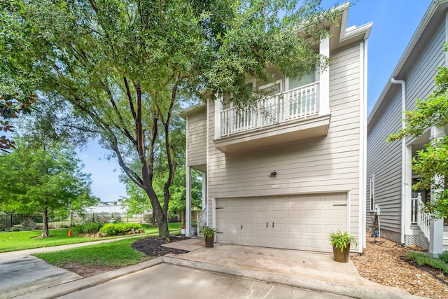 3303 New Garden View Ln, Houston, TX 77018 - view of front of property with a balcony, a garage, and driveway