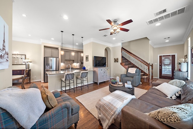 3303 New Garden View Ln, Houston, TX 77018 - living area with recessed lighting, stairway, a ceiling fan, arched walkways, and light wood-style floors