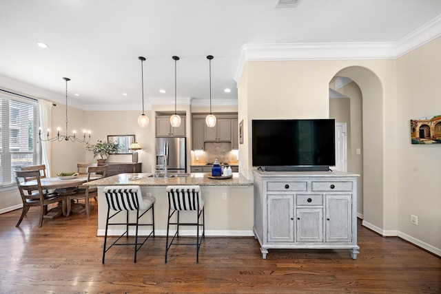 3303 New Garden View Ln, Houston, TX 77018 - kitchen with stainless steel fridge with ice dispenser, a kitchen breakfast bar, crown molding, a chandelier, and dark wood finished floors