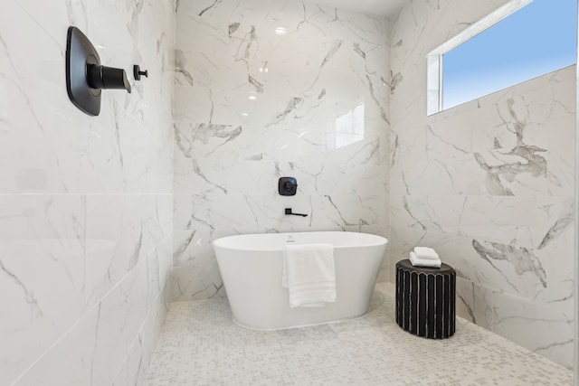 3722 Nathaniel Brown St, Houston, TX 77021 - bathroom featuring a soaking tub and tile walls