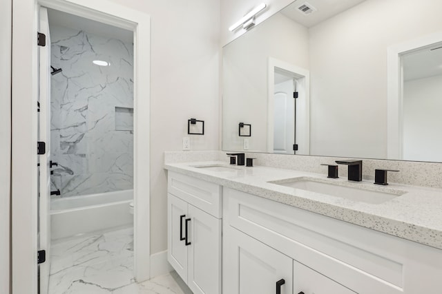 3722 Nathaniel Brown St, Houston, TX 77021 - bathroom featuring marble look tiles, double vanity, toilet, and shower / tub combination