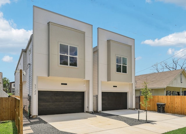 3722 Nathaniel Brown St, Houston, TX 77021 - contemporary home with an attached garage, stucco siding, and driveway