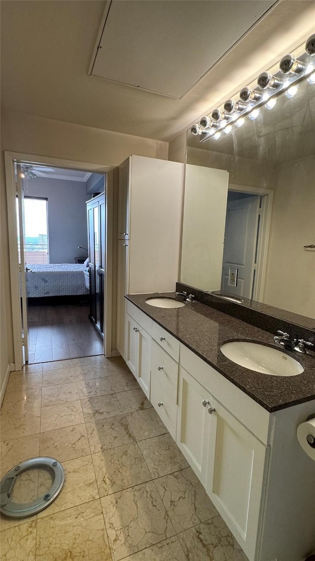 3505 Sage Rd Unit 2405, Houston, TX 77056 - ensuite bathroom with marble look tile flooring and double vanity