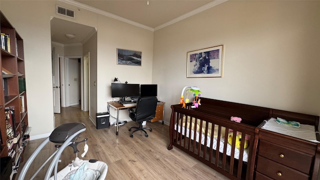 3505 Sage Rd Unit 2405, Houston, TX 77056 - bedroom with light wood finished floors, ornamental molding, an office area, and baseboards