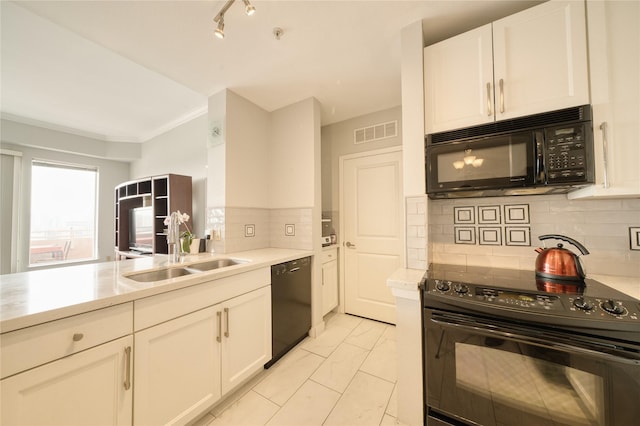 3505 Sage Rd Unit 2405, Houston, TX 77056 - kitchen featuring black appliances, light countertops, ornamental molding, white cabinetry, and light marble finish flooring