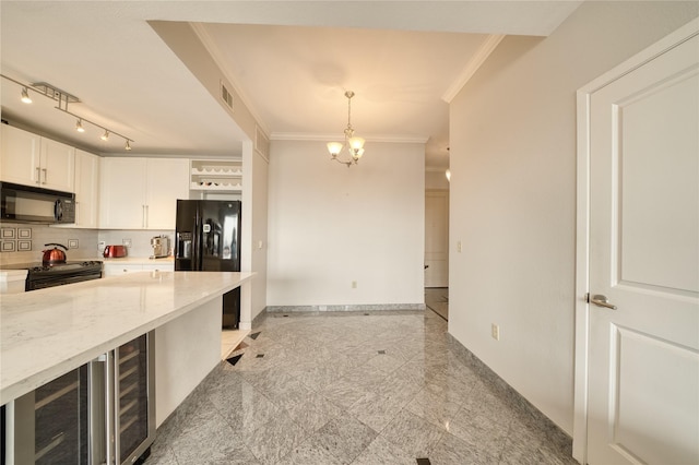 3505 Sage Rd Unit 2405, Houston, TX 77056 - kitchen featuring black appliances, granite tiled floors, ornamental molding, white cabinetry, and hanging light fixtures