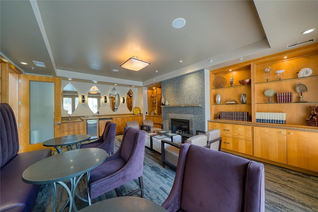 3505 Sage Rd Unit 2405, Houston, TX 77056 - living area featuring a raised ceiling, a fireplace, and wood finished floors