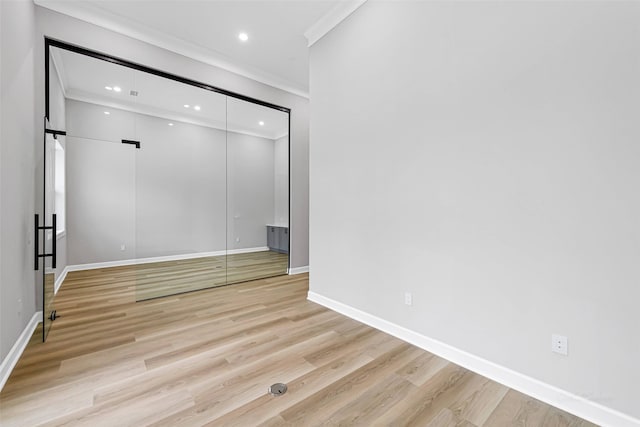1325 Main St Unit 1103, Katy, TX 77494 - spare room featuring ornamental molding, light wood-style flooring, baseboards, and recessed lighting